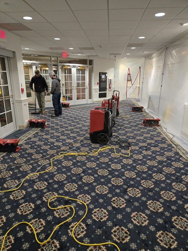 Church corridor under containment during water damage restoration