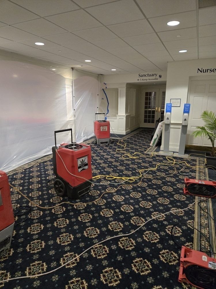 Drying equipment running across church carpet after a water loss