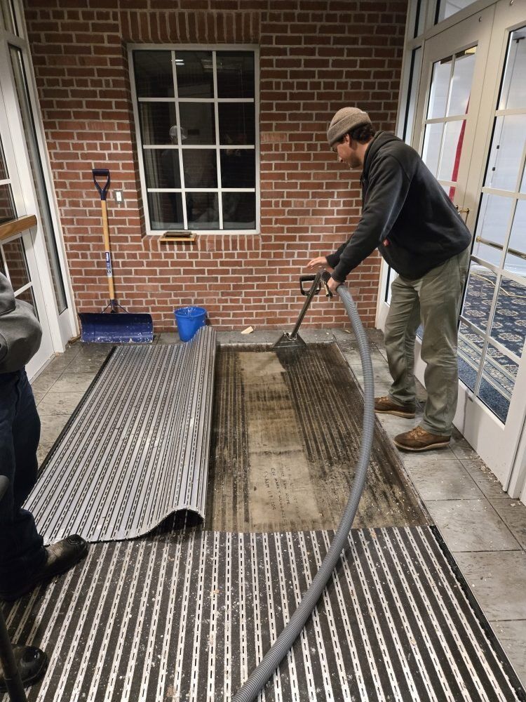 DriForce technician removing saturated carpet at a church property