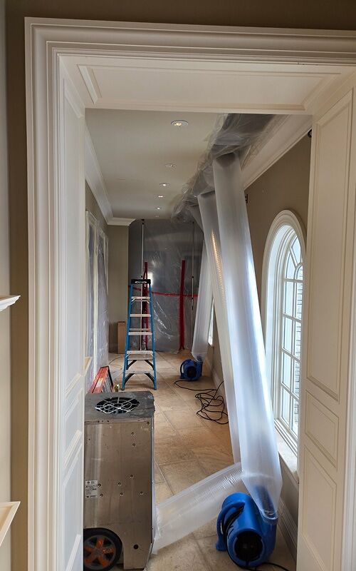 Containment and drying equipment protecting an Oakland County home during professional restoration