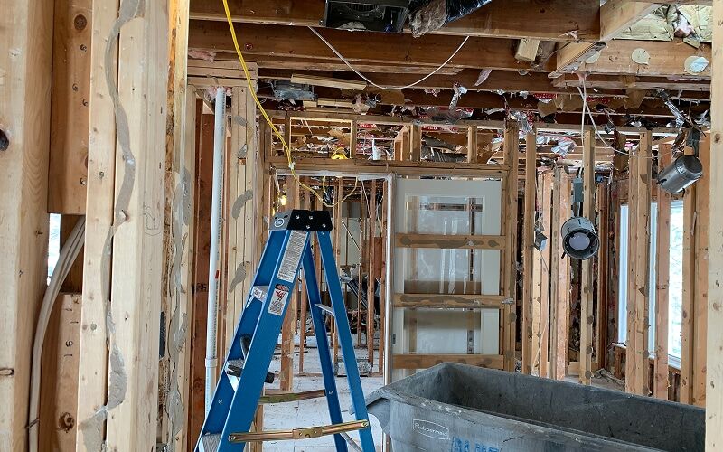 Interior framing exposed after saturated drywall and insulation were removed