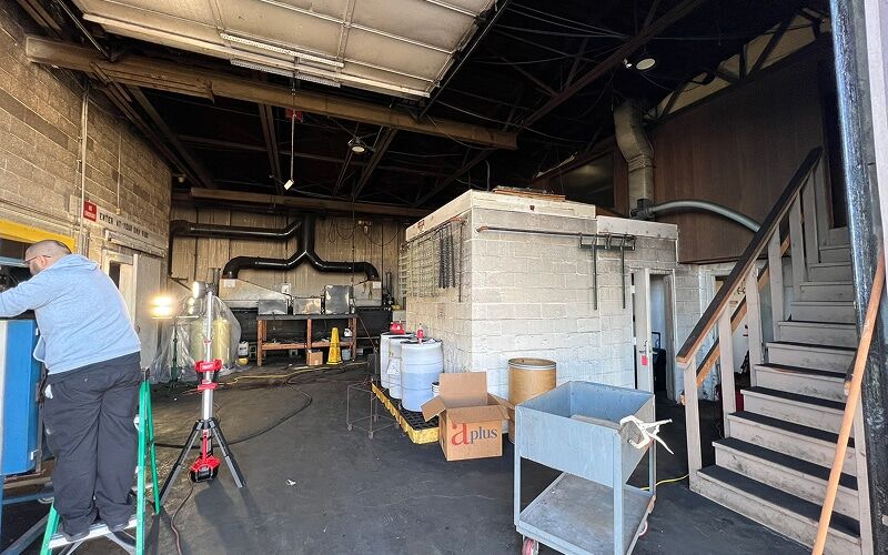 DriForce crew working inside a fire-damaged Michigan property with equipment staged
