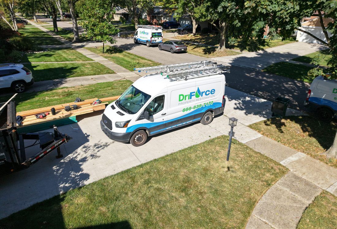 Aerial view of a DriForce Property Restoration van and crew working at a home in Metro Detroit