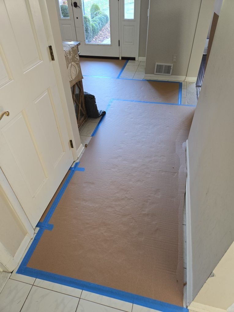 Floor and common-area protection installed in an occupied building before restoration work begins