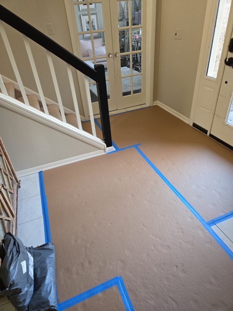 Floor protection laid through a residential entry and staircase