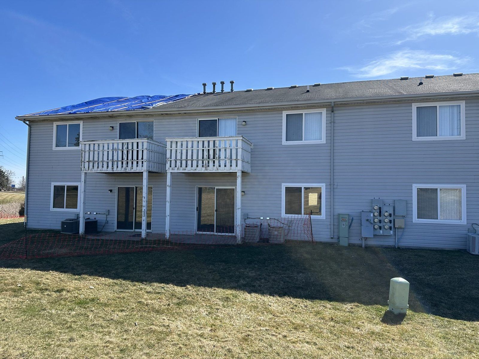 Rear elevation of the Oakbrooke multi-unit building during restoration