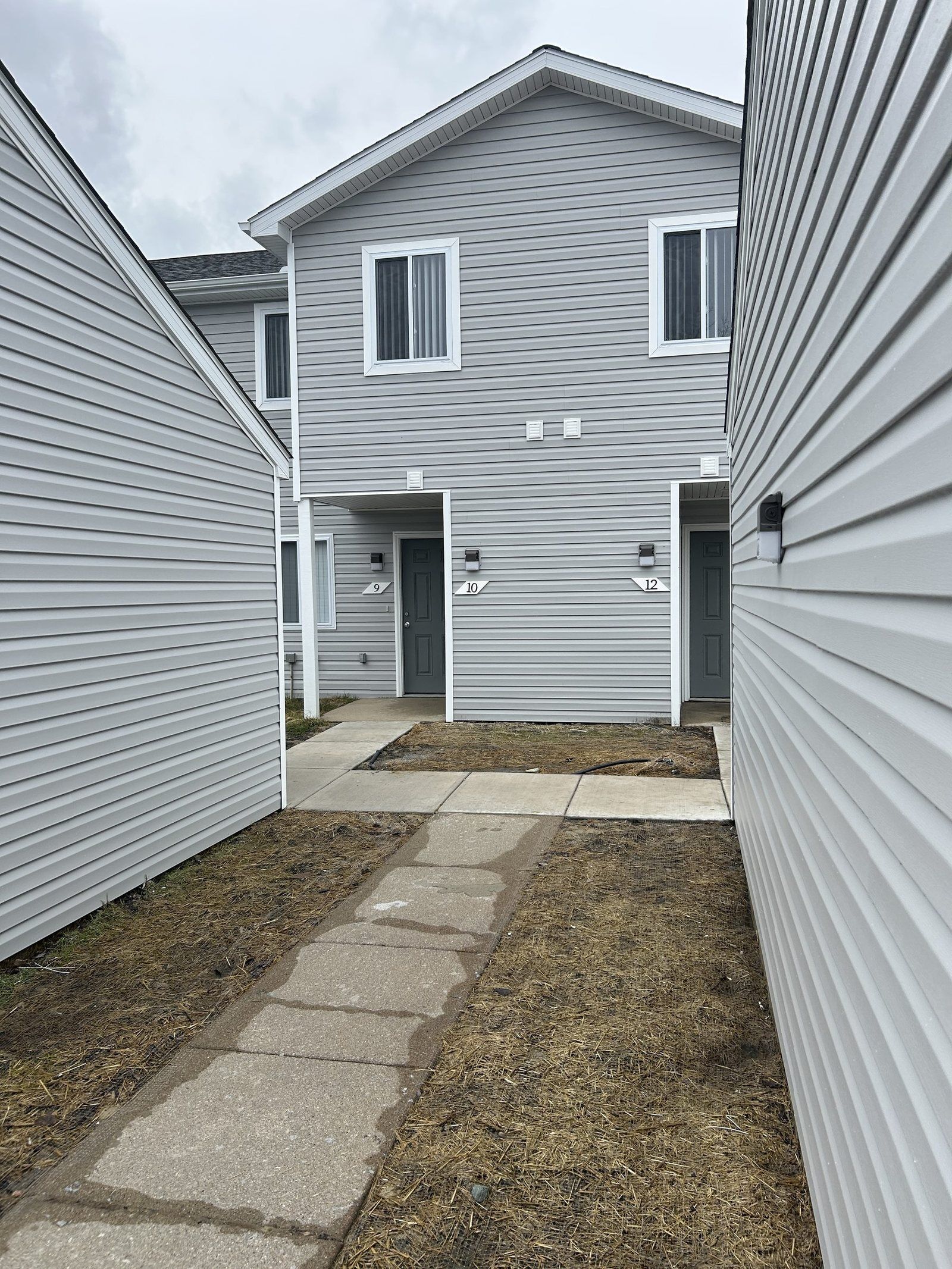 Restored Oakbrooke apartment exterior with new siding after fire damage reconstruction