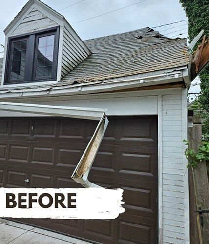 Garage with wind-damaged roof and fallen gutter - before storm damage repair by DriForce