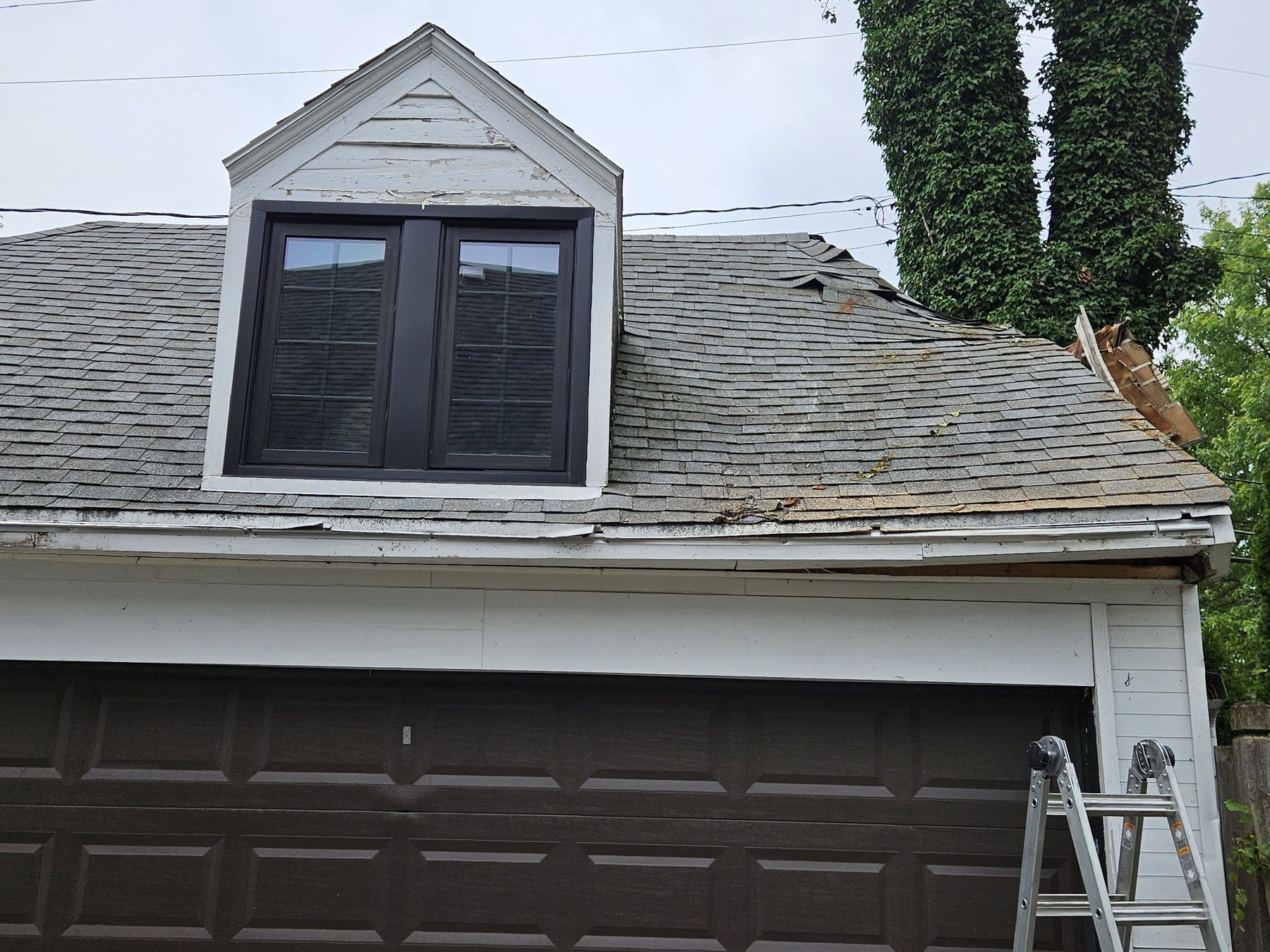 A DriForce crew responding to a wind-damaged Metro Detroit roof during an emergency call
