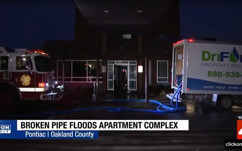 WDIV news coverage of a broken pipe flooding a Pontiac apartment complex with a DriForce truck on scene overnight
