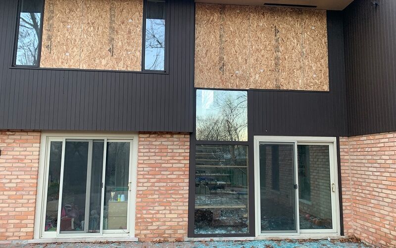 Boarded-up building exterior secured by DriForce emergency board-up after a fire in Metro Detroit
