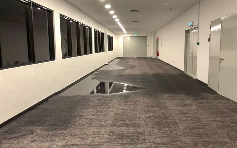 Commercial office corridor drying after a water loss near the Big Beaver corridor