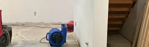 Air movers drying a Metro Detroit basement after a water loss - DriForce Property Restoration