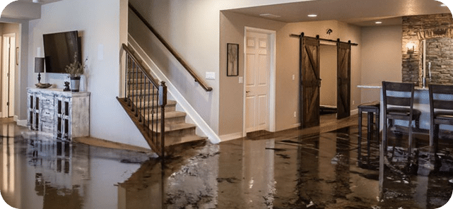 Severe flooding in a kitchen and living area of a home